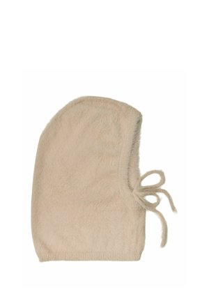 Weiche beige gestrickte Mütze mit seitlich gebundener Schleife, die dafür ausgelegt ist, Kopf und Ohren zu bedecken.