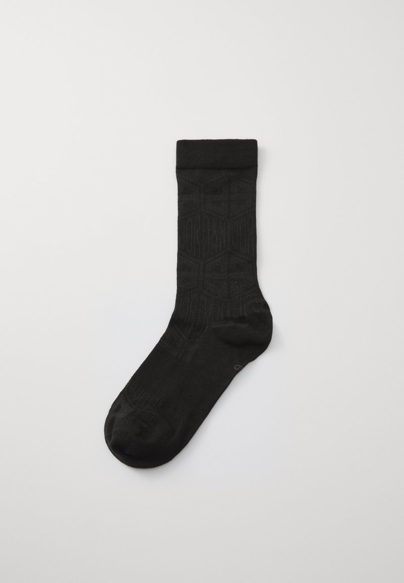 Sosete negre de echipă cu un model texturat și o culoare solidă. Manșetă ribbed în partea de sus pentru o potrivire perfectă. Finisaj neted pe toată suprafața.