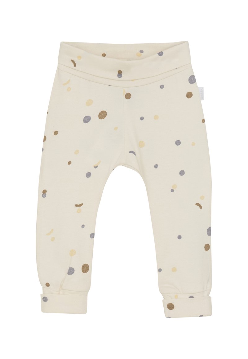 Cremefarbene Babypants mit umgeschlagenen Bündchen, die ein Muster aus kleinen beige, braunen und grauen Punkten zeigen, die überall verteilt sind.