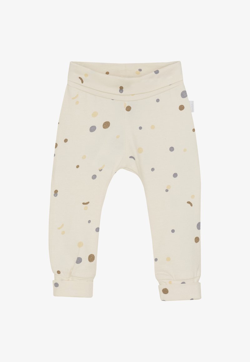 Cremefarbene Babypants mit umgeschlagenen Bündchen, die ein Muster aus kleinen beige, braunen und grauen Punkten zeigen, die überall verteilt sind.