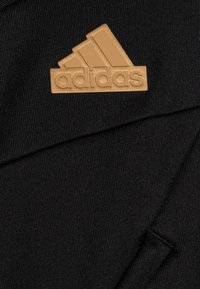 adidas Performance TIRO NATIONS PACK UNISEX - Treniņjaka - black/tan/team victory red