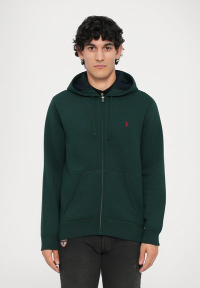 Groene rits-hoodie van een katoenmix, met een frontale rits, kangoeroezakken en een klein rood logo op de borst. Gstructuurstof.