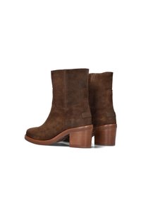 Brown suede ankle boots with stacked wooden heels, round toes, and pull tabs at the back, shown from a side and rear angle.