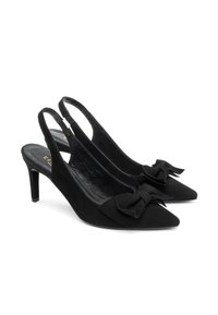 Black slingback heels made of suede, featuring pointed toes and a tied bow detail at the front. Slim, mid-height heels.