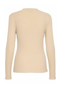 Langärmliges, ribbed Oberteil in hellbeige aus einem strukturierten, dehnbaren Stoff. Mit einem dezent ausgefransten Saum und einem runden Halsausschnitt.