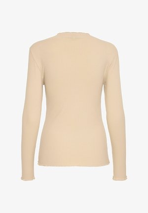 Long-sleeve ribbed top in light beige with a textured, stretch fabric. Features a subtly frayed hem and a round neck design.