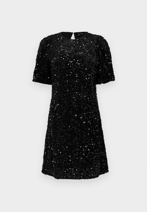 Juoda trumpa rankovėmis suknelė, odos paminkštinta blizgučiais, apvaliu iškirpimu ir užsegimu su rakto skylute nugaros pusėje. A formos siluetas su tekstūriniu paviršiumi.