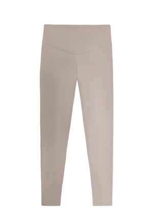 Leggings beige a vita alta con fascia a V, lunghezza integrale e design aderente su sfondo semplice.
