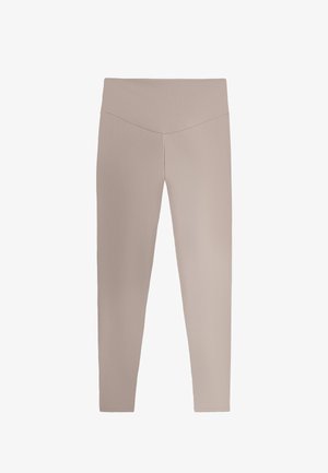 Leggings beige a vita alta con fascia a V, lunghezza integrale e design aderente su sfondo semplice.