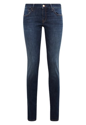 Dark blue denim skinny jeans featuring a five-pocket design, subtle yellow stitching, and a front button closure. Smooth texture throughout.