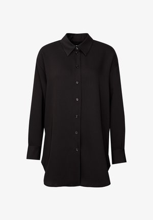 Black long-sleeve shirt made of smooth fabric with a pointed collar, front buttons, and a relaxed fit. Features buttoned cuffs and side slits.