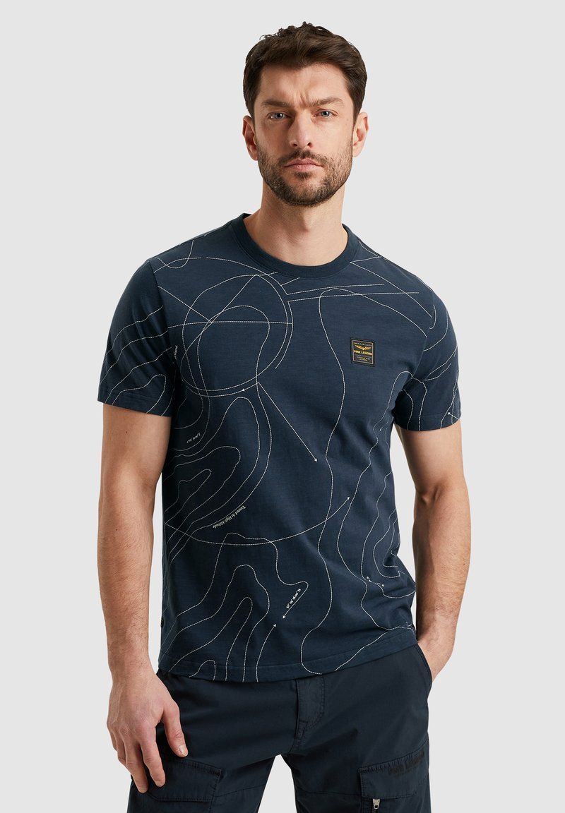 Navy blue cotton t-shirt featuring a line map pattern in white. Crew neck, short sleeves, and a small logo patch on the left chest.