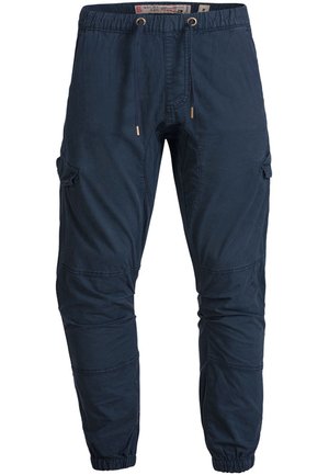 Pantalon cargo bleu marine avec ceinture élastique, cordon de serrage, multiples poches, jambes fuselées et poignets froncés. Fabriqué en tissu léger.