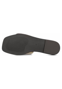 Black rubber shoe sole with textured surface and ridges. Features a slight heel and marked size 38 on the bottom.