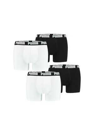 Puma Herren Boxershorts in Schwarz und Weiß mit elastischen Bändern, die das "PUMA"-Logo tragen. Weicher Baumwollstoff, enganliegende Passform, glatte Textur.