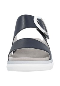 Navy leather slide sandal featuring two crossed straps, cutouts, a large white circular buckle accent, and a white rubber sole.
