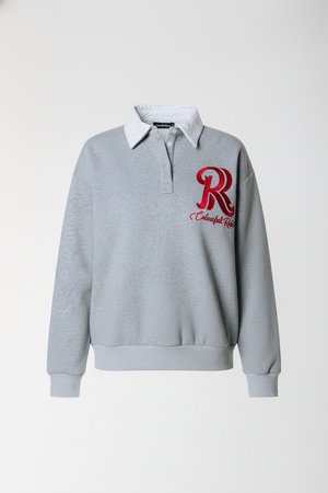 Grey sweatshirt with a white collar, featuring a red embroidered "R" logo. Long sleeves with ribbed cuffs and hem. Soft cotton material.