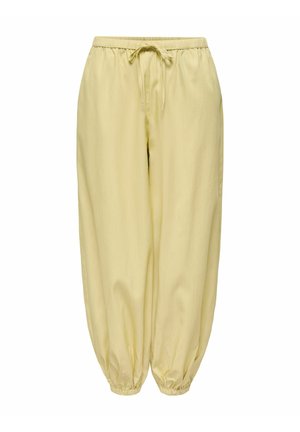Pantalon ample jaune clair avec taille élastique et poignets, doté d'un cordon de serrage à l'avant pour un ajustement réglable.