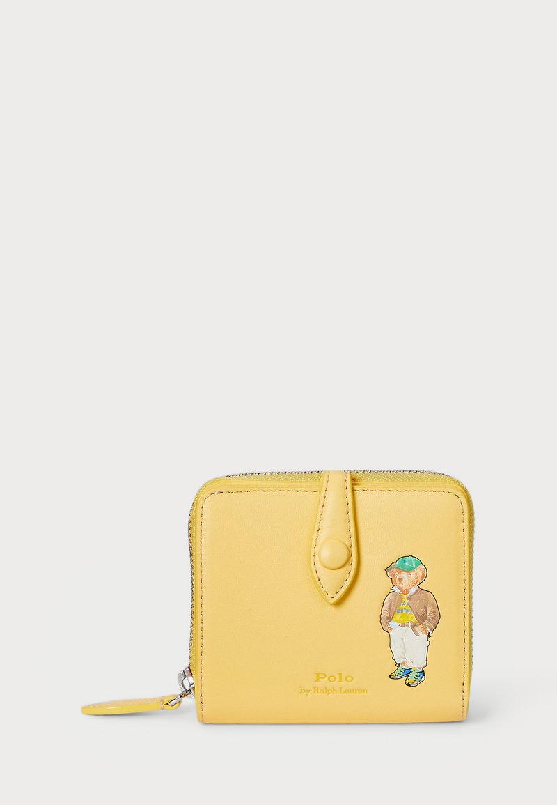 Yellow leather wallet with a zip closure, featuring a bear graphic, and "Polo by Ralph Lauren" embossed on the front.