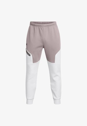 Joggers de color rosa claro y blanco con cintura elástica, bolsillo lateral, textura suave y bloques de color contrastante en las piernas.