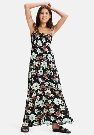 Floral maxi dress featuring a black base, elastic smocked bodice, and tiered skirt with large pastel and red flowers. Adjustable spaghetti straps.