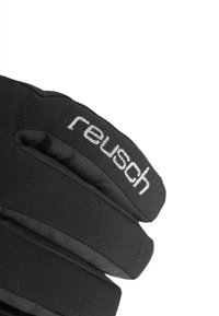 Gants Reusch noirs présentant un tissu texturé avec un design rembourré. Un logo blanc bien visible est embossé sur la bande supérieure.