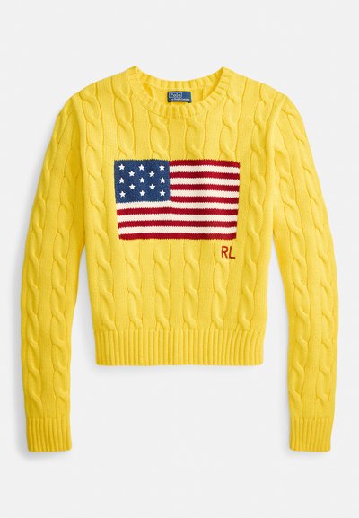 Rumena pulover iz tkanine s kablem, na katerem je kateri je pravokotni motiv ameriške zastave v rdeči, beli in modri barvi, z rebrastimi manšetami in spodnjim robom. Logotip na prsih.