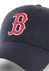 Navy baseball cap made of cotton, featuring a prominent red and white embroidered "B" logo. Curved brim with textured fabric detail.