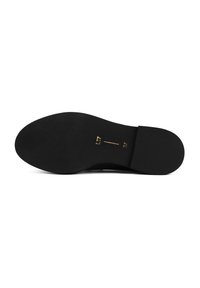 Black shoe sole with a smooth texture, rounded shape, and flat bottom. Gold markings indicate size and model number near the heel.