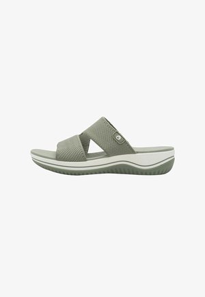 Grüne Mesh-Slipper-Sandale mit zwei überkreuzten Riemen, strukturiertem Obermaterial, gepolsterter Innensohle und einer weißen Zwischensohle mit Gummisohle für besseren Halt.