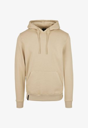 Beige hoodie with a front pocket, drawstring hood, ribbed cuffs, and hem, made of soft fabric, featuring a label on the lower side.