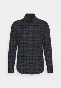 Svart och blå rutigt flanellskjorta med knäppning vid kragen, långa ärmar och rundad nederkant. Tyget har en mjuk, strukturerad yta.