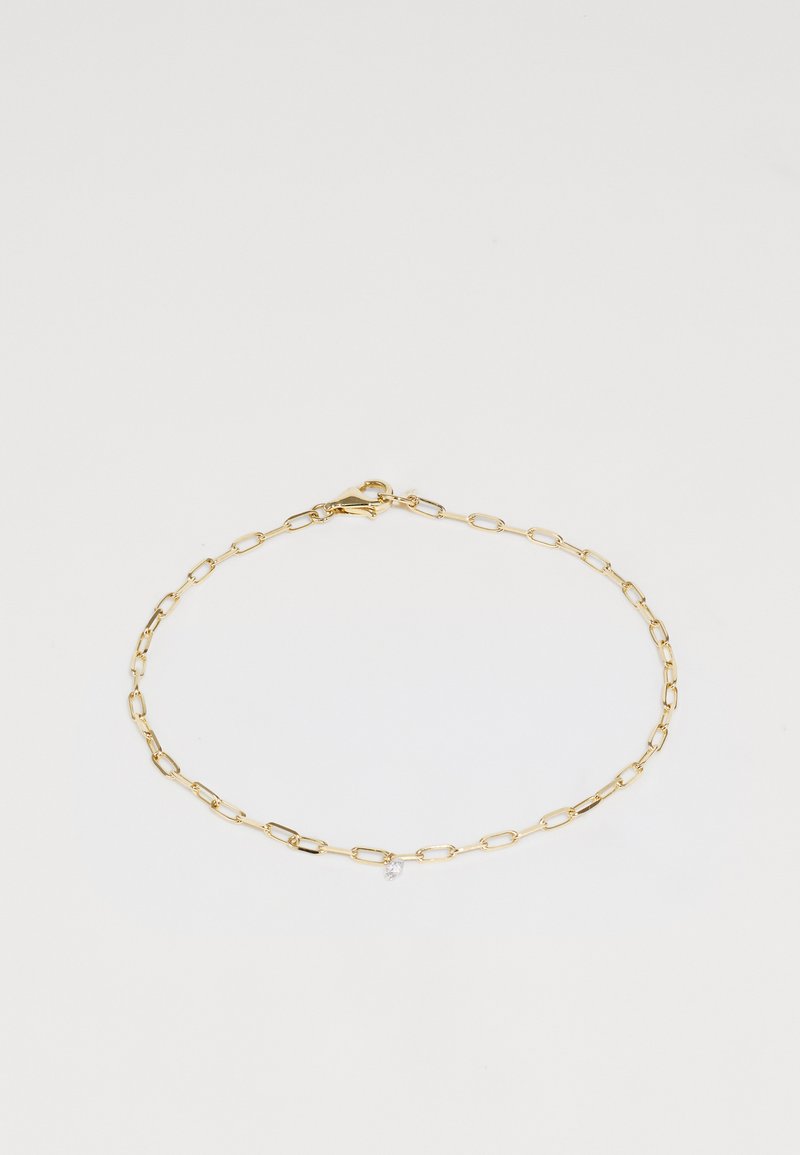 Auksinis apyrankė su pailgomis popierinio segtuko tipo jungtimis, su maža skaidria brangakmenių akcentu ir omaro tipo užsegimu.