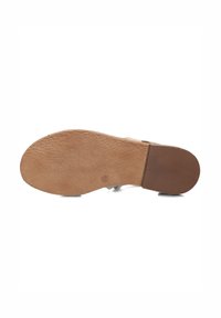 Tan rubber shoe sole with textured surface, featuring a brown, ridged accent towards the heel. Overall flat design, minimal detailing.