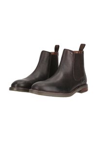 Mörkbruna läder Chelsea-boots med elastiska sidopaneler, rund tå, dragflikar och en texturerad yta. Platt sula med subtil accentdetalj.