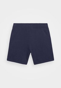 Navy modré bavlněné šortky s měkkým elastickým pasem, lemovaným zakončením a hladkou texturou. Vhodné pro volnočasové nošení nebo sport.