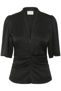 Black blouse with short puff sleeves, v-neckline, and front ruching. Made of textured fabric featuring a subtle geometric pattern.