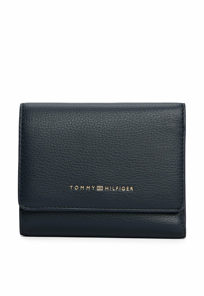 Black textured leather wallet with gold Tommy Hilfiger logo centered on the front flap, against a plain white background.