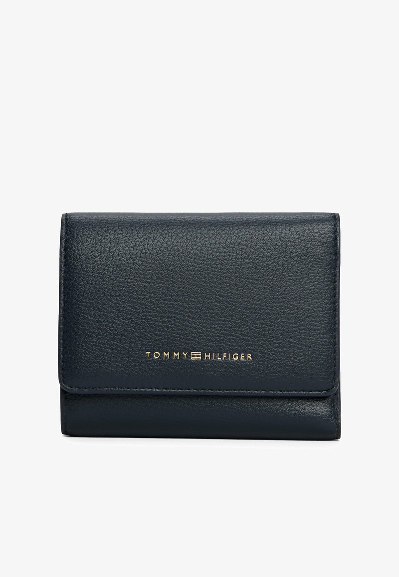 Black textured leather wallet with gold Tommy Hilfiger logo centered on the front flap, against a plain white background.