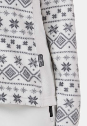 Fleece jacket in white with gray snowflake and geometric patterns. Features a zipper pocket and a label with the brand name.