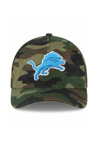 Tarnmütze aus Cord mit einem blauen, gestickten Löwenlogo auf der Vorderseite. Leicht gebogener Schirm und texturiertes Gewebe.