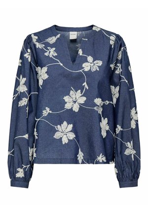 Denimtopp med V-hals, lange puffermet ermer og hvit blomsterbroderi. Har en avslappet passform og teksturert stoff.