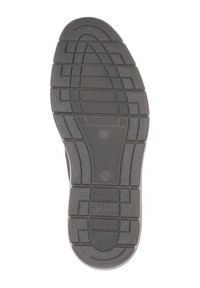 Semelle de chaussure en caoutchouc noir avec des motifs de texture et des rainures pour une meilleure traction. Présente un logo embossé sur la semelle.