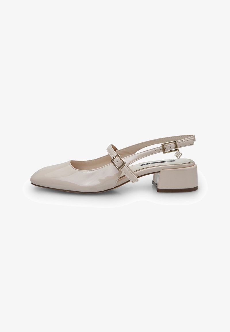 Beige patent leather slingback shoe with a pointed toe, adjustable buckle strap, and a low square heel. Smooth texture with glossy finish.