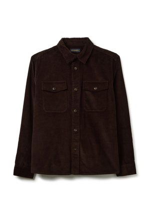 Camicia in velluto a coste marrone caratterizzata da un colletto, chiusura frontale con bottoni, due tasche sul petto e texture a coste. Maniche lunghe con polsini a bottoni.