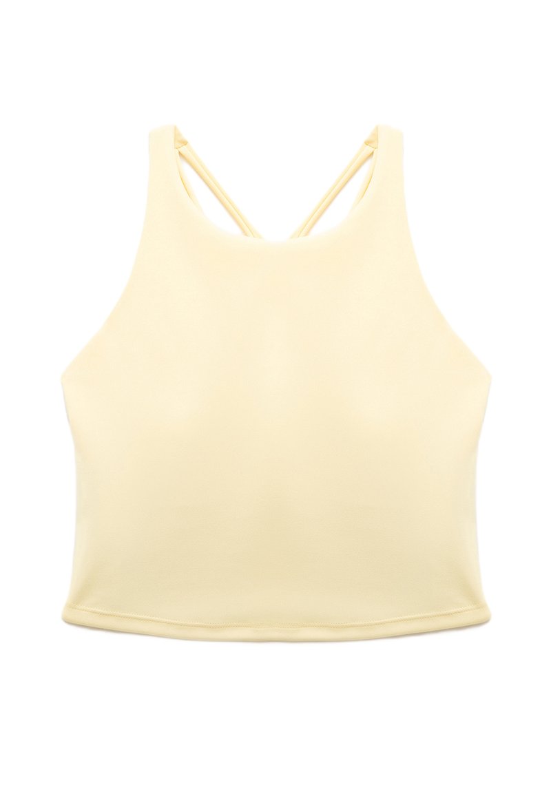 Farkapaiset vaaleankeltainen crop-top, jossa on korkea kaula-aukko ja ohut ristikkäin kulkeva selkäremmi, aseteltuna tasaiseksi valkoista taustaa vasten.