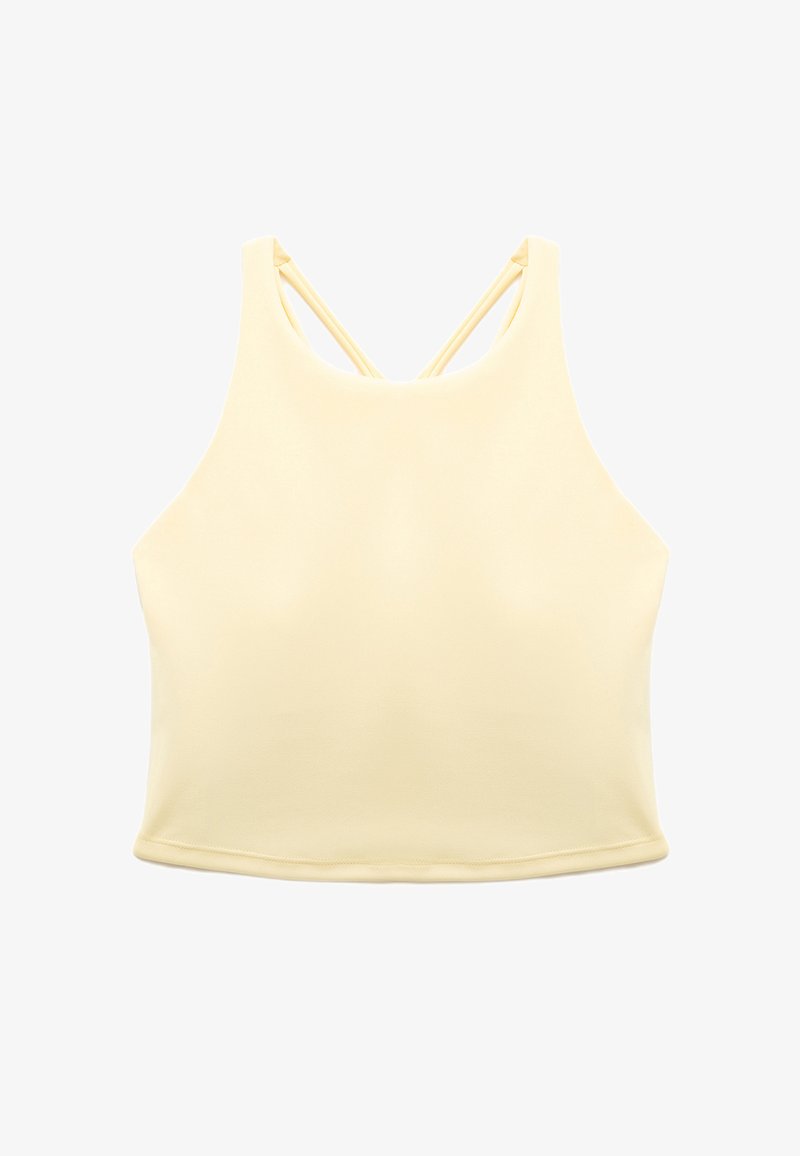 Ärmlös ljusgul crop top med hög halsringning och tunna korsettsankar på baksidan, utlagd platt på en vit bakgrund.