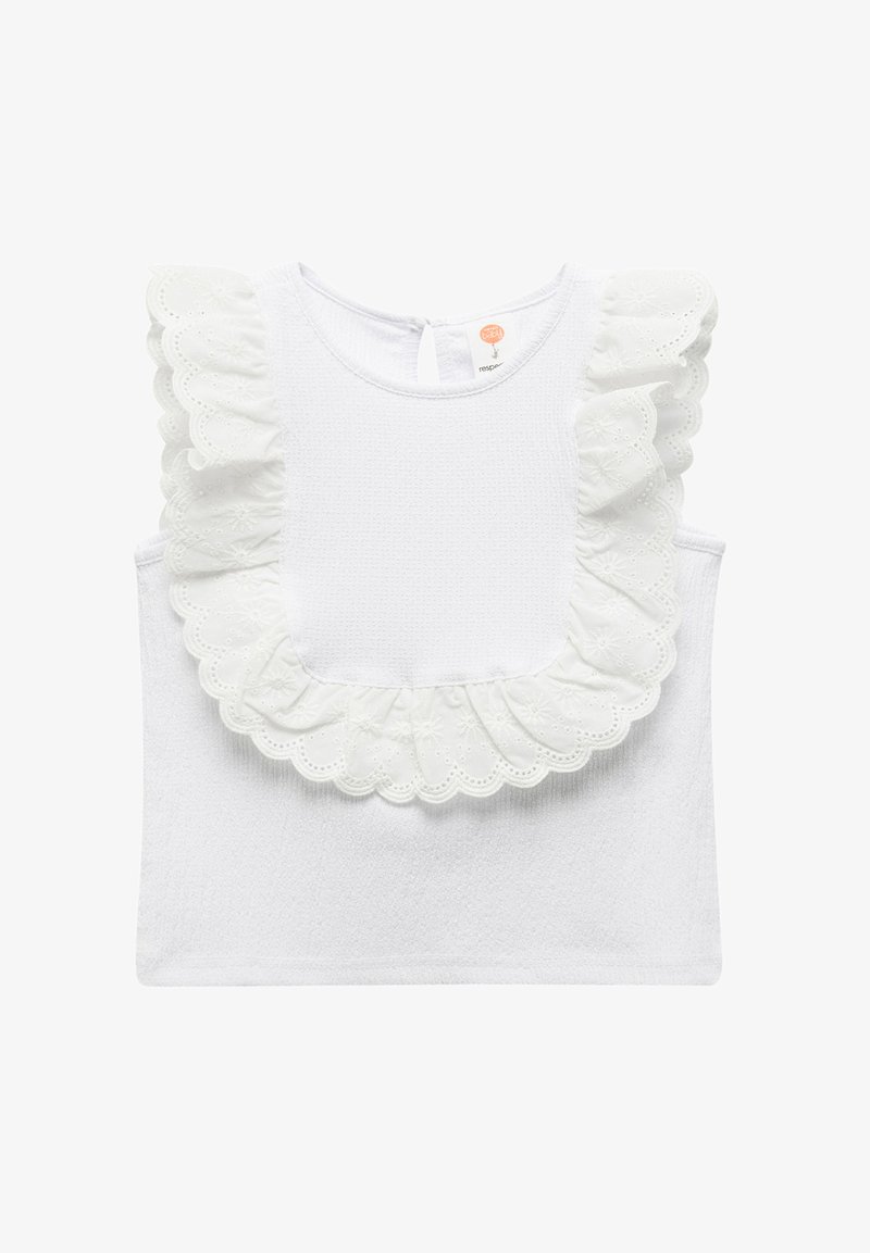 Valkoinen hihaton paita, jossa on teksturoitu vartalo, suuri rei'itetty pitsiröyhelö kaula-aukolla ja takana avaus avainaukolla.