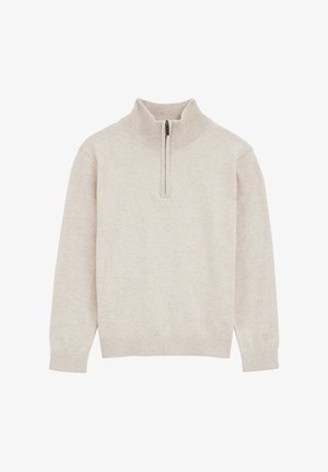 Jersey beige con cremallera en el cuello tipo mock, puños y bajo acanalados, confeccionado en una mezcla de telas suaves, con un diseño y textura minimalistas.