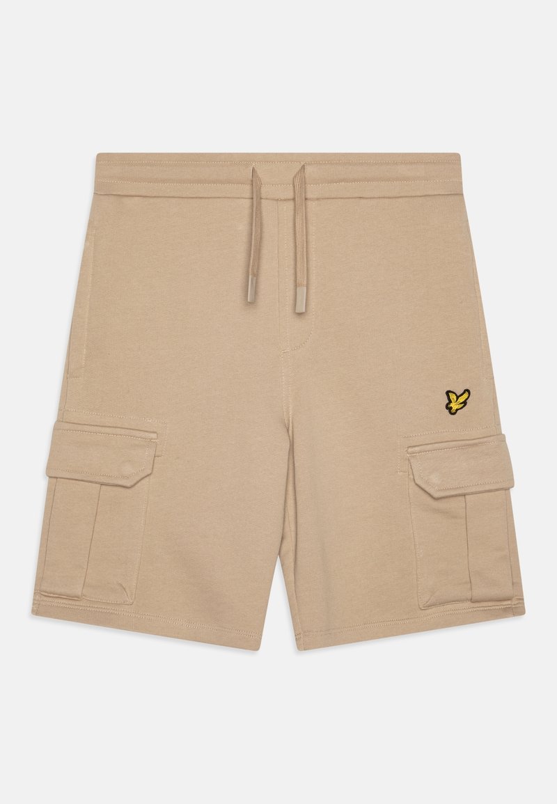 Short cargo beige avec taille à cordon, poches latérales à rabat et petit logo oiseau jaune et noir sur la poche droite.